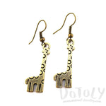 Polka Dotted Giraffe Shaped Dangle Charm Earrings in Brass | DOTOLY