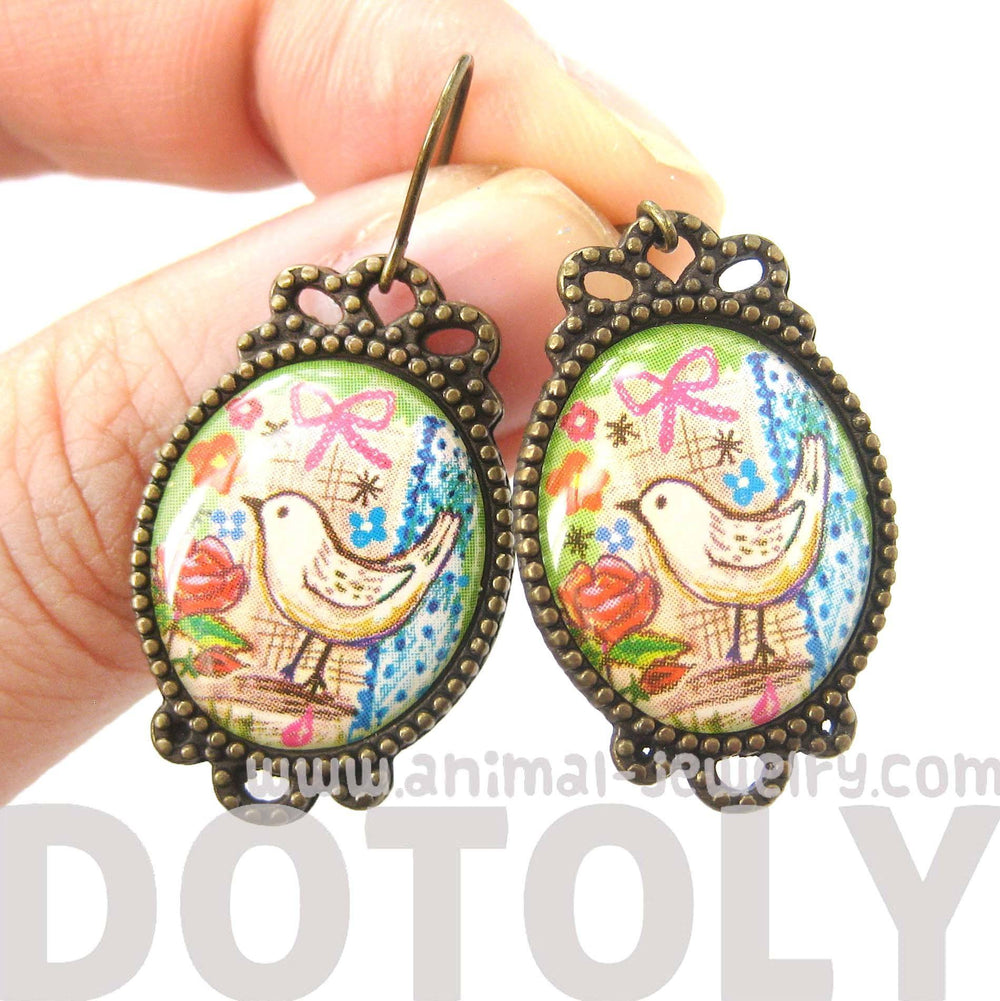 Pretty Oval Dove Bird Illustrated Resin Dangle Earrings | Animal Jewelry | DOTOLY