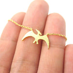 Pterodactyl Dinosaur Silhouette Prehistoric Animal Themed Charm Necklace in Gold | DOTOLY