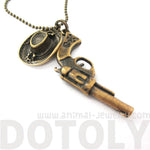 Realistic Gun Pistol Revolver and Cowboy Hat Shaped Pendant Necklace in Bronze | DOTOLY | DOTOLY