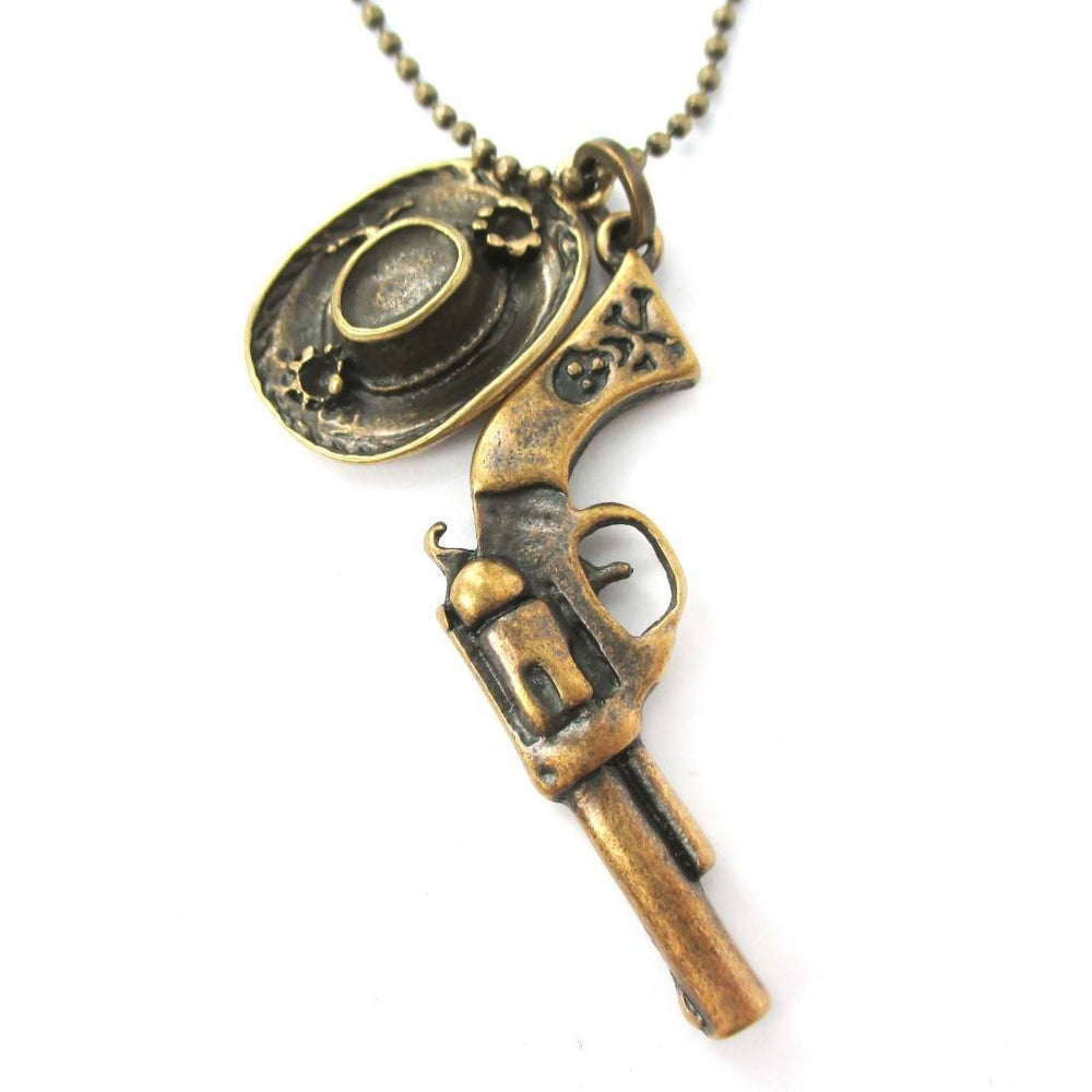 Realistic Gun Pistol Revolver and Cowboy Hat Shaped Pendant Necklace in Bronze | DOTOLY | DOTOLY