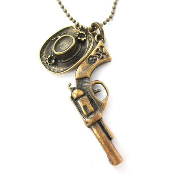 Realistic Gun Pistol Revolver and Cowboy Hat Shaped Pendant Necklace in Bronze | DOTOLY | DOTOLY