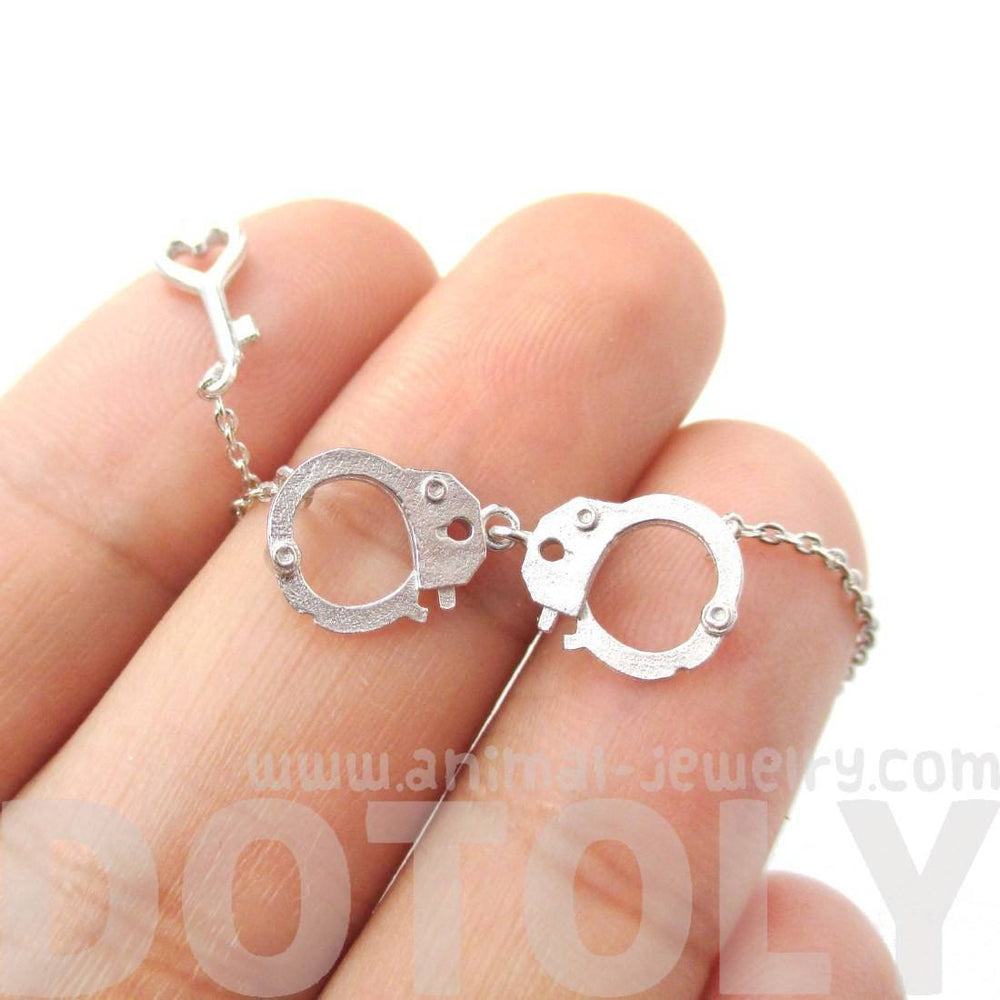 Realistic Handcuff and Heart Shaped Key Charm Necklace in Silver | DOTOLY | DOTOLY