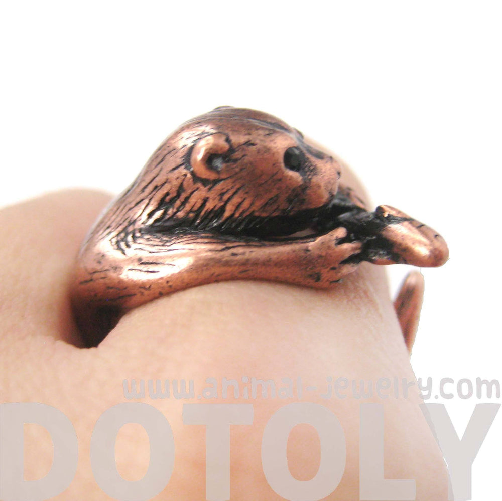 Realistic Otter Holding a Fish Shaped Animal Wrap Ring in Copper | US Sizes 4 to 9 | DOTOLY