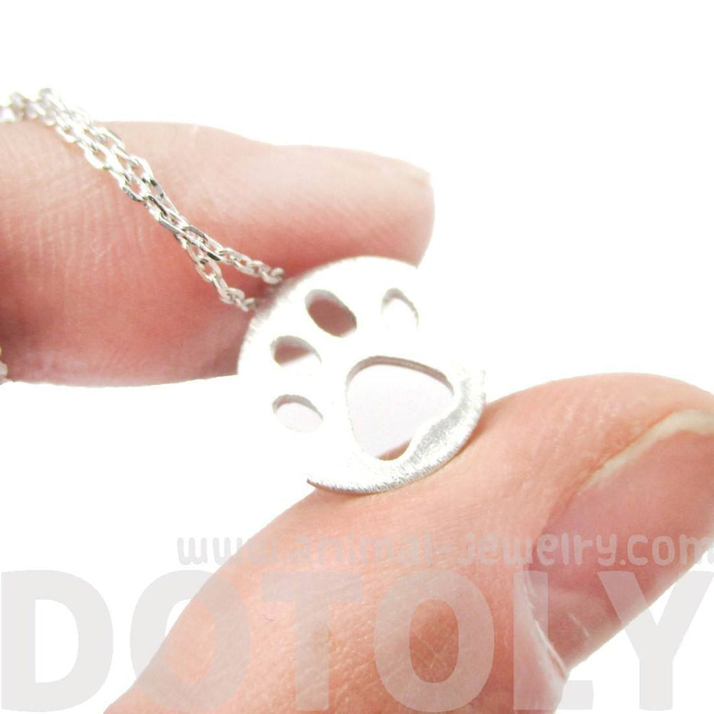 Round Puppy Paw Print Cut Out Shaped Pendant Necklace in Silver | Animal Jewelry | DOTOLY