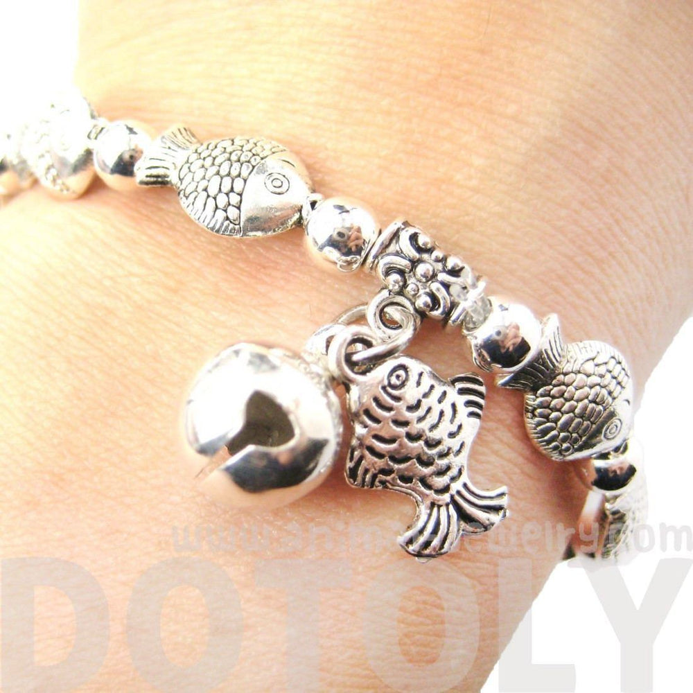 Row Of Fish Shaped Sea Animal Stretchy Bracelet in Silver | Animal Jewelry | DOTOLY