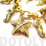 Sea Creatures Themed Charm Bracelet in Gold: Starfish Seahorse Seashell Dolphins | DOTOLY
