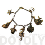 Seashell Turtle Starfish Seahorse Sea Creatures Charm Bracelet in Bronze | DOTOLY