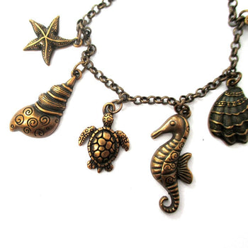 Seashell Turtle Starfish Seahorse Sea Creatures Charm Bracelet in Bronze | DOTOLY