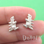 Small Godzilla Shaped Dinosaur Stud Earrings in Silver | DOTOLY