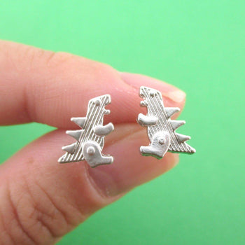 Small Godzilla Shaped Dinosaur Stud Earrings in Silver | DOTOLY