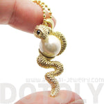 Snake Wrapped Around a Pearl Shaped Animal Pendant Necklace in Gold | DOTOLY