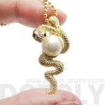 Snake Wrapped Around a Pearl Shaped Animal Pendant Necklace in Gold | DOTOLY