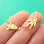 Spaceship and Astronaut Space Travel Themed Charm Necklace in Gold | DOTOLY | DOTOLY