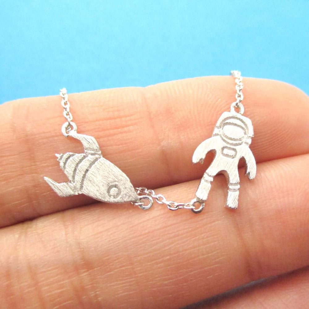 silver astronaut necklace