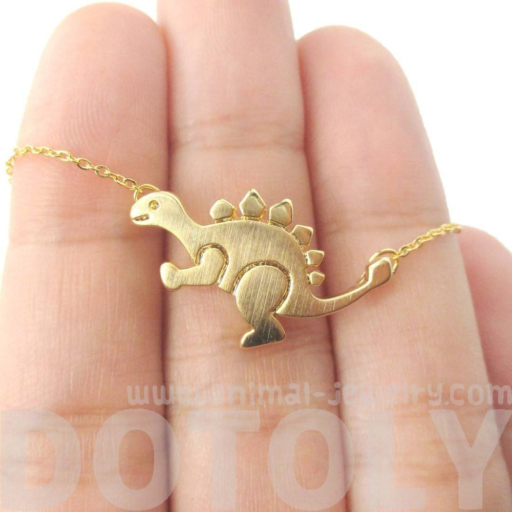 Stegosaurus Dinosaur Shaped Jurassic World Themed Pendant Necklace in Gold | DOTOLY