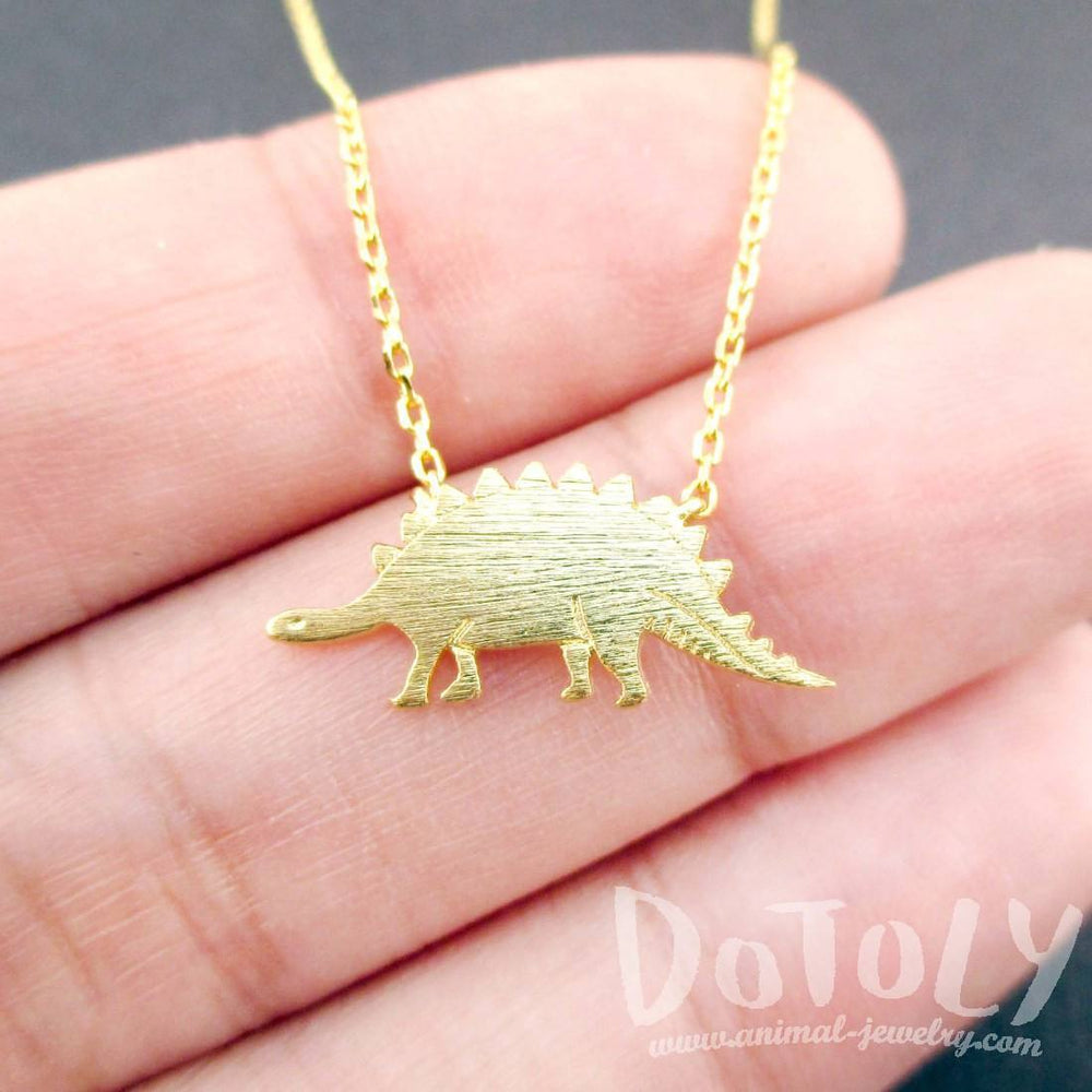 Stegosaurus Dinosaur Silhouette Jurassic World Themed Charm Necklace in Gold | DOTOLY