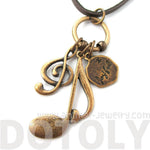 Treble Clef Musical Quaver Note and Dove Shaped Charm Necklace in Brass | DOTOLY