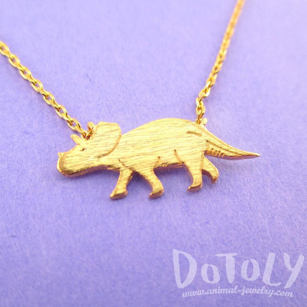 Triceratops Dinosaur Silhouette Jurassic World Themed Charm Necklace in Gold | DOTOLY