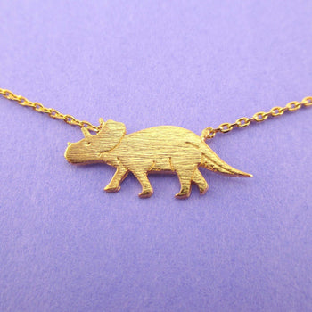 Triceratops Dinosaur Silhouette Jurassic World Themed Charm Necklace in Gold | DOTOLY