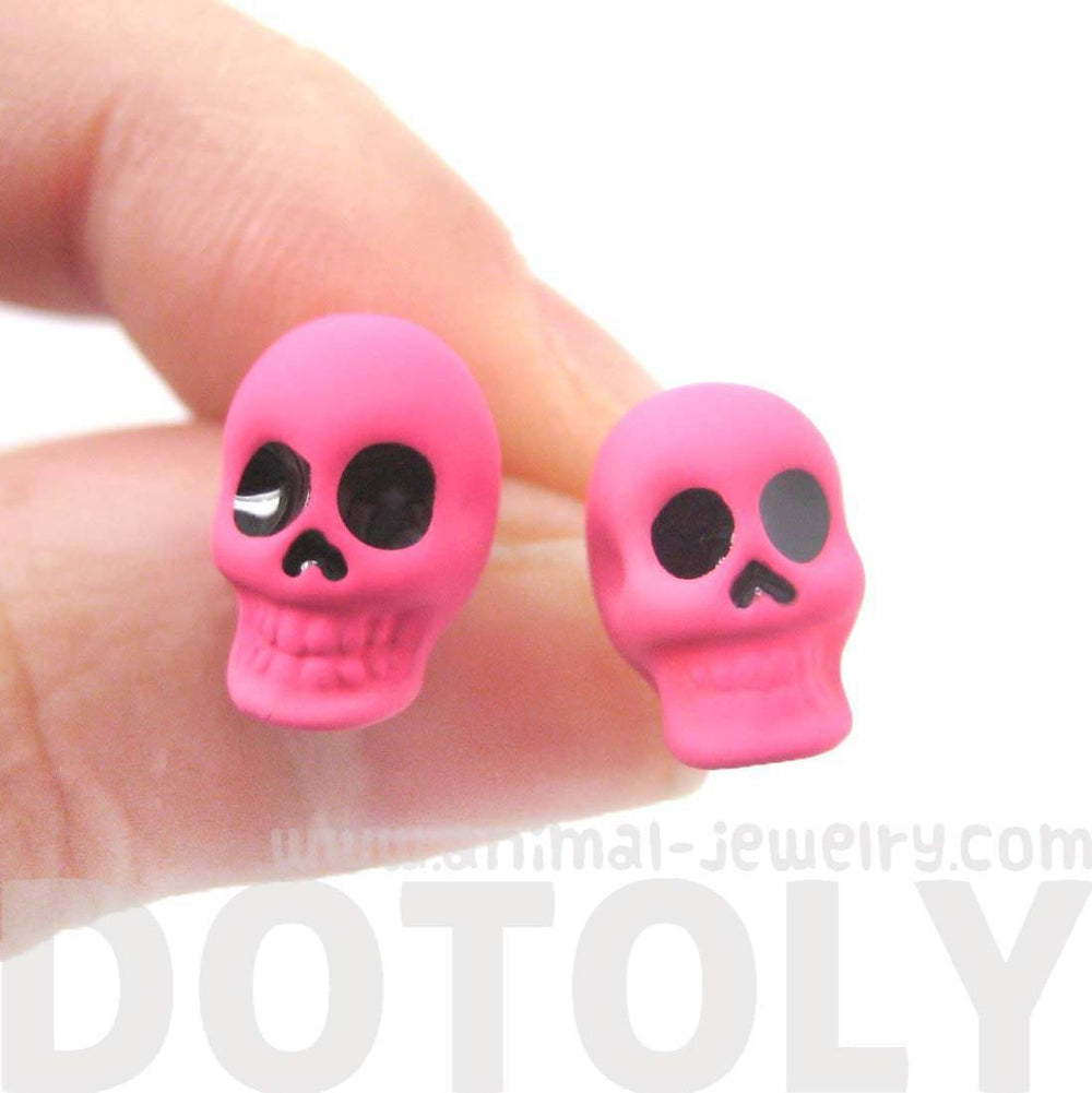 Unisex Skull Shaped Skeleton Themed Rocker Chic Stud Earrings in Neon Pink | DOTOLY