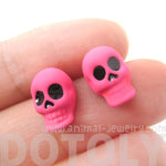 Unisex Skull Shaped Skeleton Themed Rocker Chic Stud Earrings in Neon Pink | DOTOLY