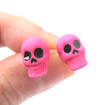 Unisex Skull Shaped Skeleton Themed Rocker Chic Stud Earrings in Neon Pink | DOTOLY