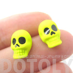 Unisex Skull Shaped Skeleton Themed Rocker Chic Stud Earrings in Neon Yellow | DOTOLY