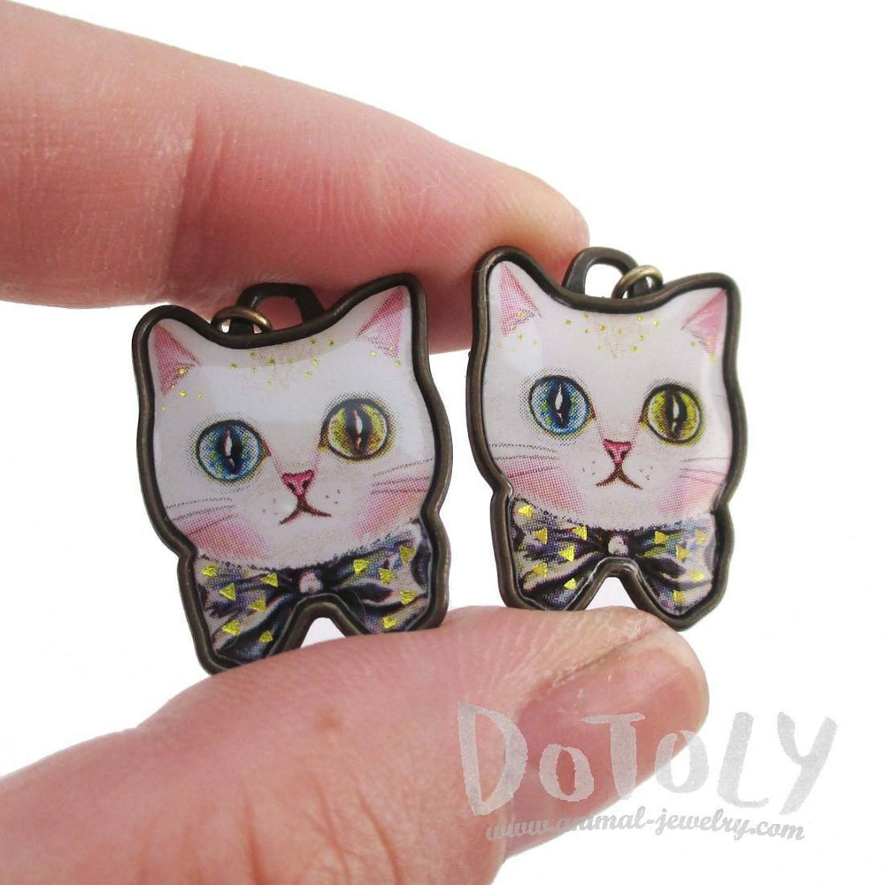 White Odd Eyed Cat With a Bow Shaped Enamel Dangle Earrings | DOTOLY