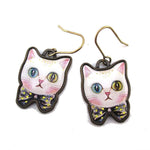 White Odd Eyed Cat With a Bow Shaped Enamel Dangle Earrings | DOTOLY